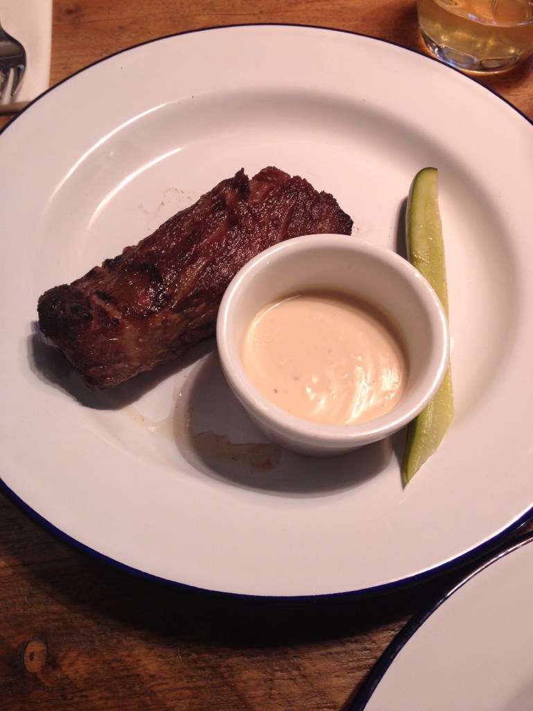 BARBECUED GRAIN-FED SHORT RIB, HOMEMADE DILL PICKLE, MUSTARD & BLACK TREACLE