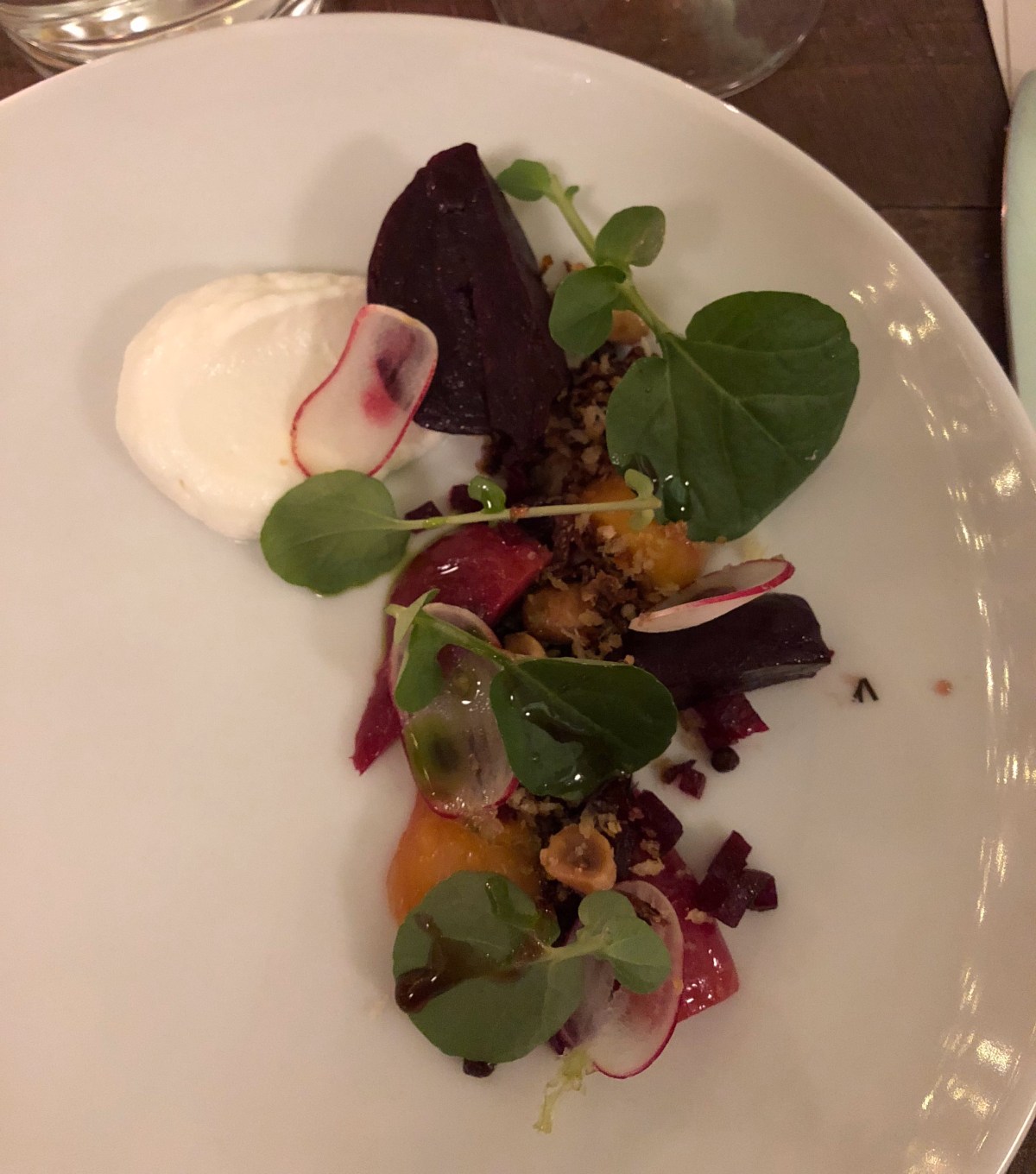 Roast young beetroots, goat's curd, hazelnuts, radish and dill