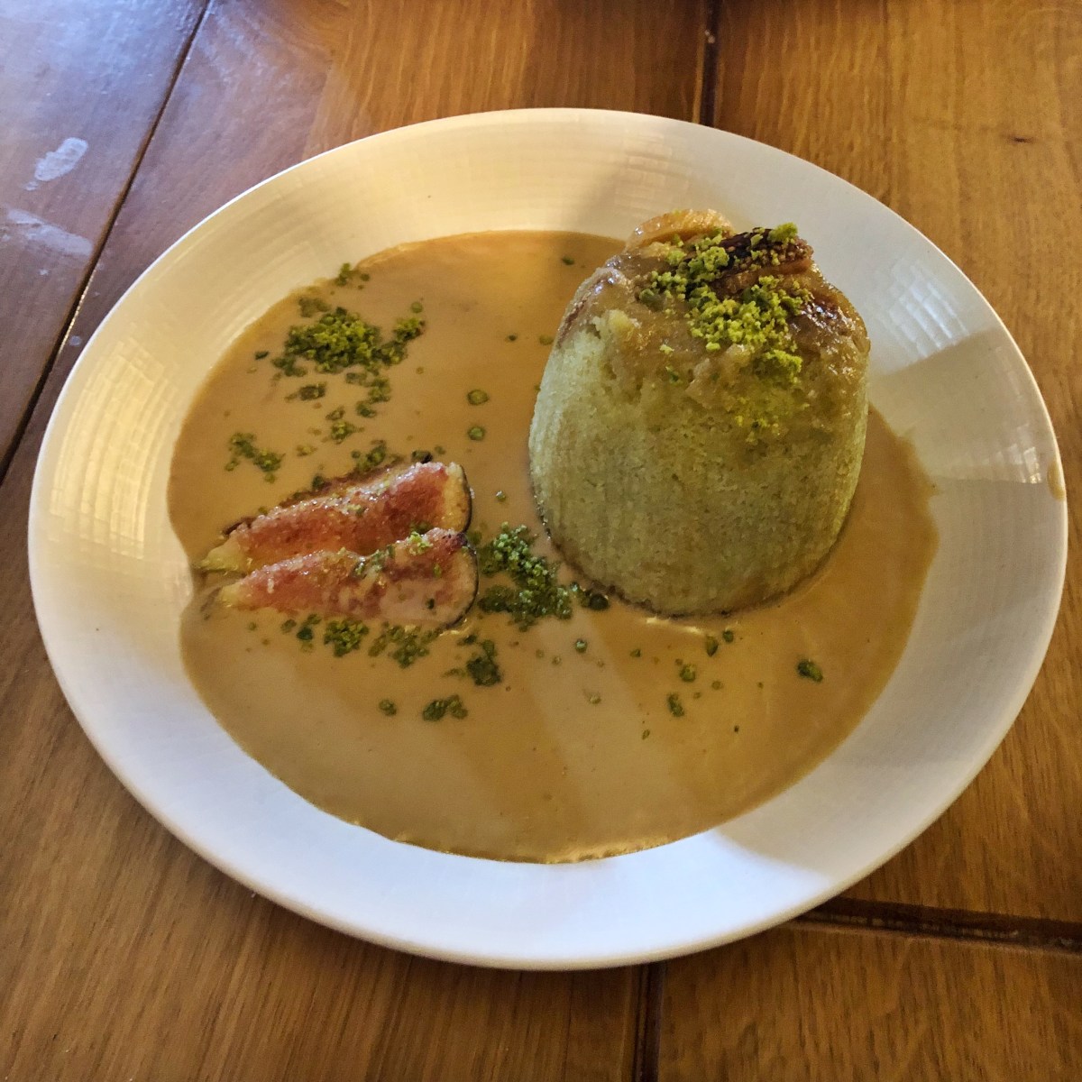 Sponge Pudding, pistachio, fig, whisky custard